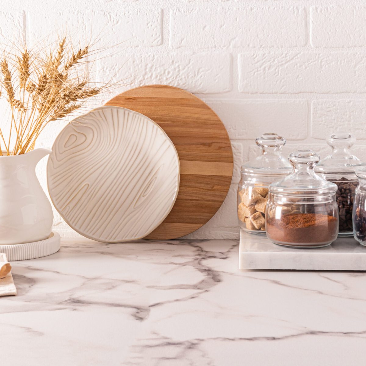 beautiful kitchen background in light colors and a modern storage area in glass jars of various bulk products. front view. eco tableware
