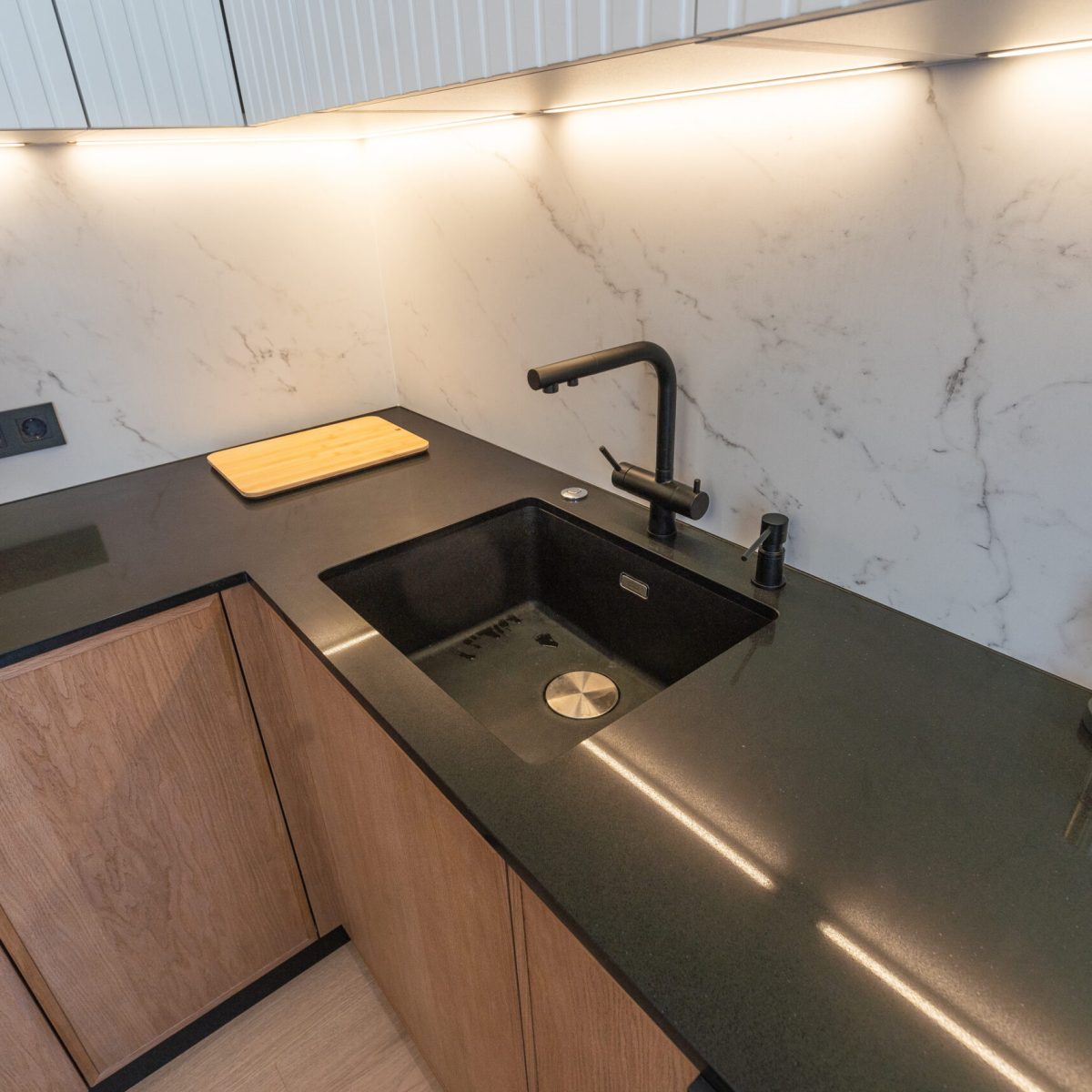Details of modern design trendy kitchen sink with water tap faucet. High quality photo